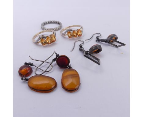 Two 9ct gold Dress Rings, set three facetted orange stones, possibly fire opal, with diamond accents on each shoulder, one Si