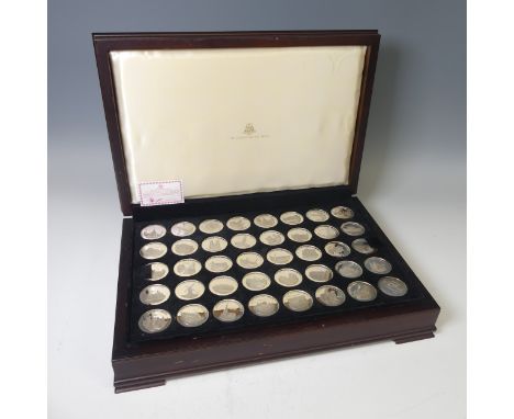 The 'Ancient Counties of England'; a cased display of forty silver Medallions, issued by the Birmingham Mint, hallmarked betw