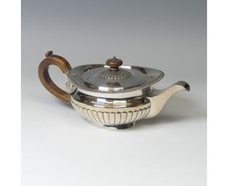 A George III silver Teapot,&nbsp;by Samuel Hennell, hallmarked London, 1813, of circular form with demi-fluted decoration and