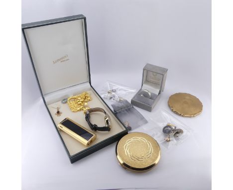 A small 9ct gold garnet Pendant, together with a 9ct gold mounted topaz pendant, a silver band, two vintage powder compacts, 