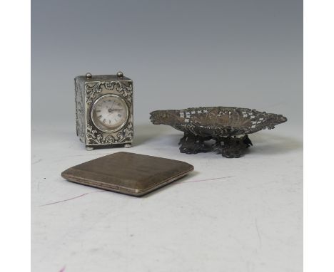 An Edwardian silver miniature Carriage Clock,&nbsp;by William Comyns &amp; Sons, hallmarked London 1905, with foliate scroll 