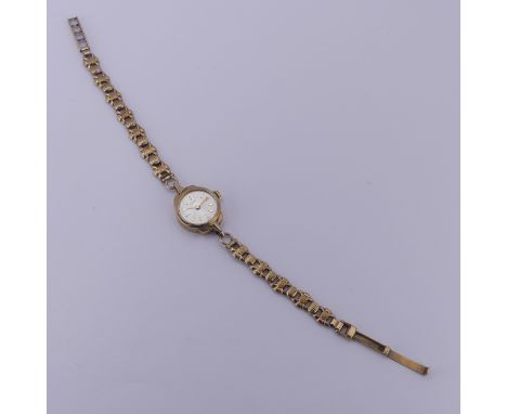A 9ct yellow gold lady's Tudor Wristwatch,&nbsp;the signed silvered dial with gilt baton markers, Tudor 17-rubies manual wind