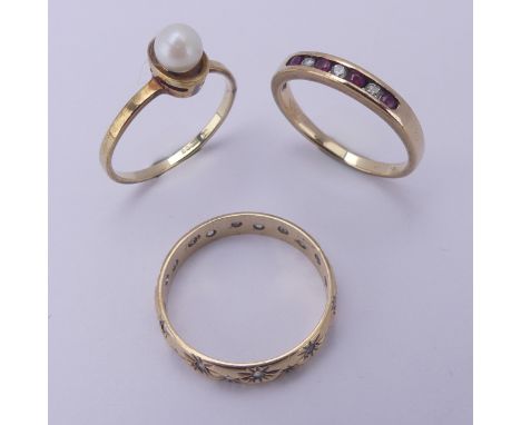 Three 9ct yellow gold Rings, one set cultured pearl, Size L, one band gypsy set white pastes, Size N, the other set small rub