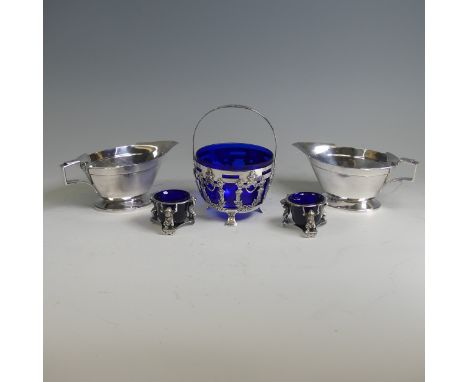 A pair of silver plated Sauce Boats, together with a pair of plated open salts with blue glass liners and a sugar bowl with s