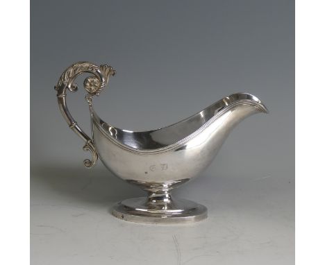 An early 19thC French silver Sauce Boat, with Paris (950) guarantee mark, 1819-1828, of traditional form with leaf capped scr