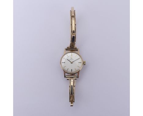 A 9ct yellow gold lady's Omega Wristwatch,&nbsp;the signed silvered dial with gilt baton markers, cal. 620 manual wind moveme