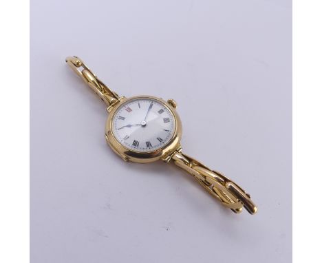 An 18ct yellow yellow gold lady's Wristwatch,&nbsp;white enamel dial with Roman numerals, with a B&amp;Co. 15-jewels manual w