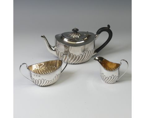 A Victorian silver three piece Tea Set, by&nbsp;Plante &amp; Co., hallmarked Birmingham 1894, of oval form with demi-fluted d