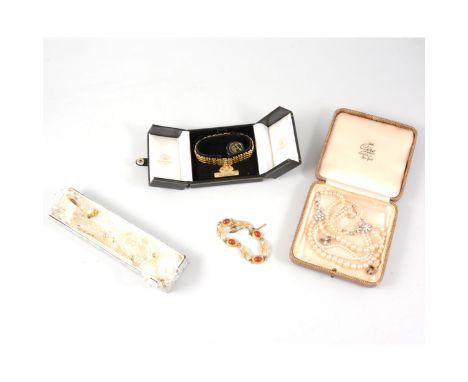 A tray of costume jewellery, a simulated pearl necklace with two strands to front and paste set floral connectors, miniature 