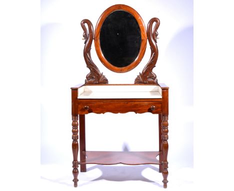 Victorian mahogany and stained wood washstand, raised oval mirror with carved supports, the top with three-quarter gallery an