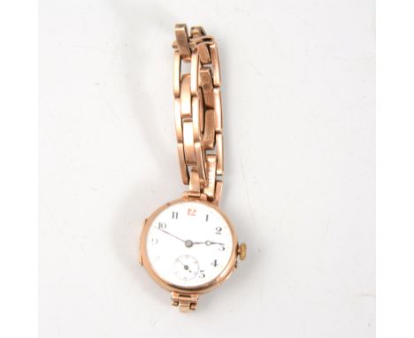 A lady's vintage wrist watch, circular 22m white enamel dial with subsidiary seconds dial, Dreadnought movement in a 9 carat 