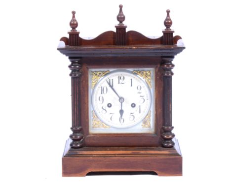 Stained beech shelf clock, silvered dial with Arabic numerals, continental movement striking on a gong, height 40cm.