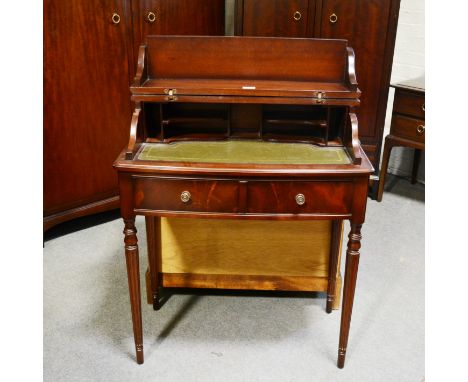 Reproduction mahogany ladies writing table, hinged lid enclosing a writing surface, above two drawers, turned and fluted legs