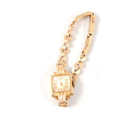 A lady's 9 carat yellow gold vintage wrist watch, square Arabic dial in a case with fluted shoulders hallmarked London 1950, 