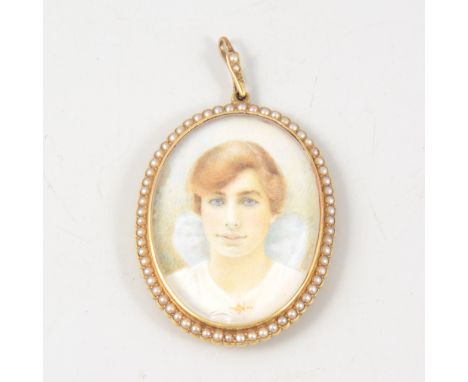 An oval portrait miniature, hand painted young lady with blue bow in her hair, 38mm x 28mm, in a yellow metal closed back mou