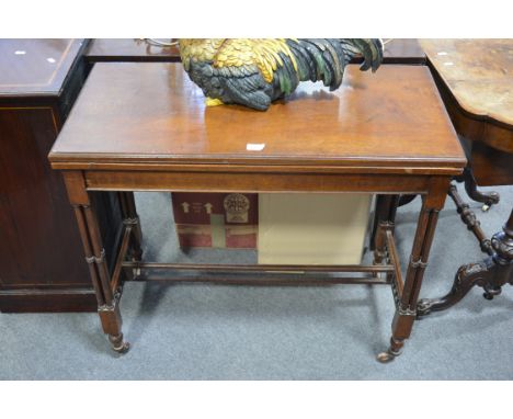 Victorian walnut card table, rectangular fold-over top, supported on cluster columns, fretted end rails, the top 88cm x 43cm,