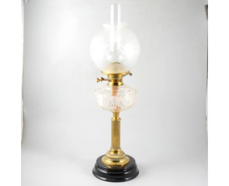 Victorian oil lamp, fluted brass column, cut-glass reservoir, with chimney and later etched shade, 70cm.