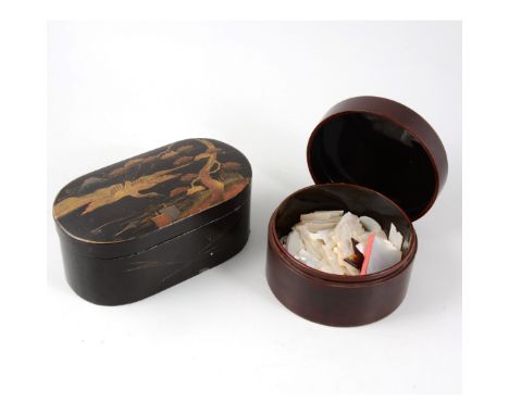 A Japanese oval laquered box with lift out tray, 17.5cm x 9.5cm and a circular box containing a quantity of mother-of-pearl g