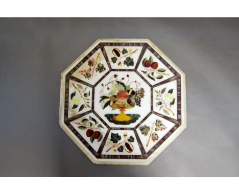 An Indian octagonal marble inlaid pietra dura table top, 20th century, with central large panel inlaid with comport and exoti