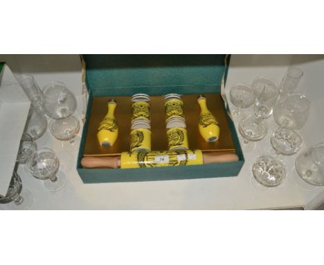 A Portmeirion Dolphin pattern seven piece table set, comprising  storage jars, rolling pin and oil and vinegar bottles, boxed