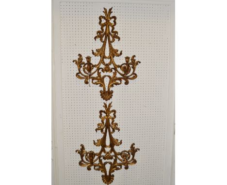 A pair of Veronese wall light fittings, moulded with ribbon tied leafy scrolls