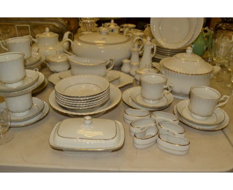 A Polish Chodziez dinner and tea service, for six, each banded in gilt, comprising large tureen, another smaller, gravy boat 