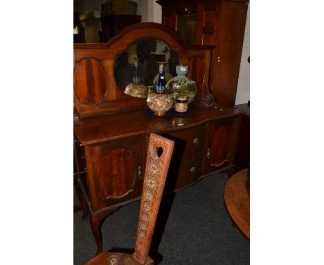 A 20th century mahogany bow fronted mirror back sideboard, two doors flanking two short drawers, cabriole legs, c.1920