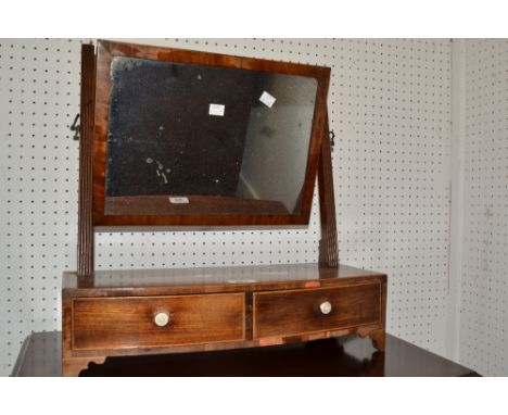 An Edwardian mahogany toilet mirror, rectangular mirror, two short drawers to bow fronted base