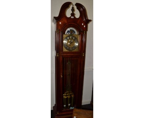 A 20th century mahogany Howard Miller longcase clock, silvered chapter ring, Arabic numerals, lunar phase to arch, striking o