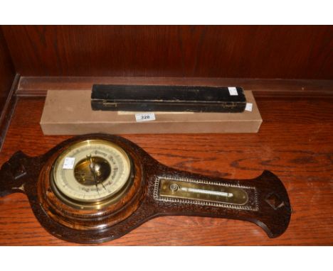 An oak barometer, mercury thermometer, c.1930;  a tyre gauge;  a Webley gun cleaning kit;  (3)
