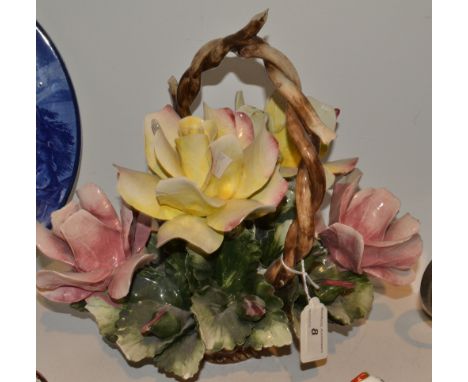 An Italian ceramic basket of roses 
