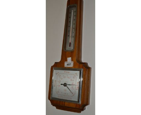 A mid 20th century oak barometer, alcohol thermometer