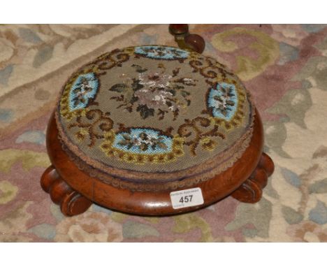 A Victorian circular mahogany beadwork foot stool, scroll feet
