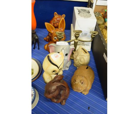 COLLECTION OF MONEY BOXES FORMED AS OWLS TOGETHER WITH A BRASS CANDLESTICK