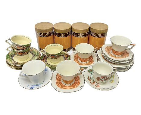 Four Portmeirion storage jars with Greek key pattern on an orange ground, together with Tams Ware tea service and other ceram