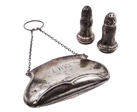 Early 20th century silver purse, with embossed detailing and monogram dated 1918 to front, opening to reveal tan fabric inter