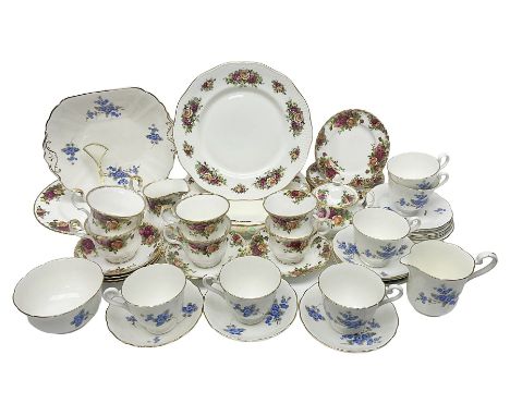 Royal albert Country Rose tea set for six, comprising teacups, saucers, dessert plates, cake plate, covered sucrier and milk 