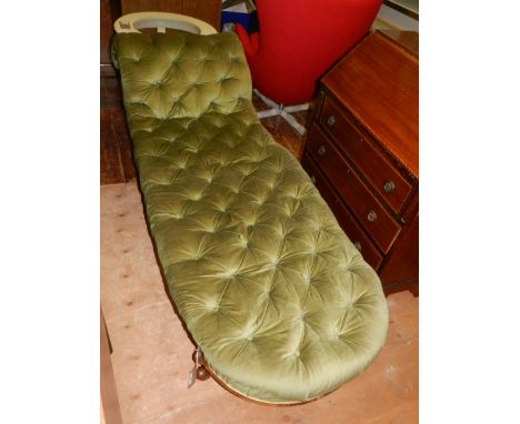 A late Victorian walnut framed chaise longue, button upholstered in green fabric and raised on moulded cabriole legs, L. 188c