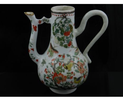 A 19th century Persian ceramic coffee pot, decorated with birds and flowers, H. 18cm