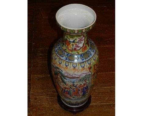 A 20th century Chinese porcelain vase, polychrome decorated with landscape scenes, figures and flowers, raised on circular ha