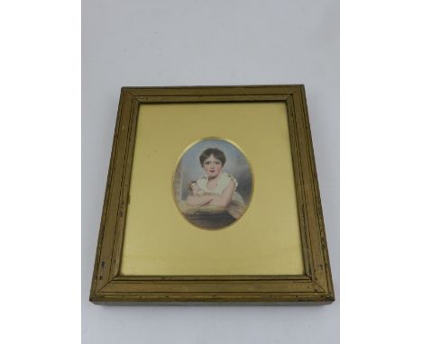 A 19th century English school, portrait miniature of a young girl leaning on a ledge with a doll, framed as an oval, 9 x 6cm.