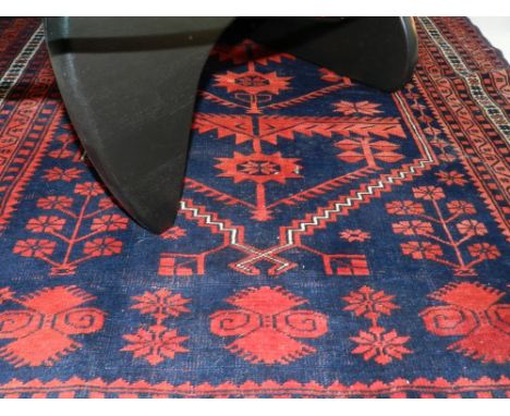 A large Turkish Yagcibedir carpet, having central medalion on a red ground, double bordered and fringed.