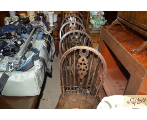 A set of four stick and wheel back chairs 