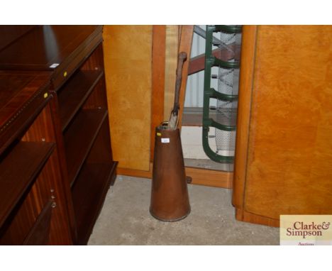A copper coal scuttle and contents of toasting fork, walking stick, parasol etc.