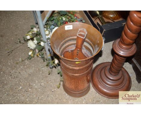 A brass stick stand and contents of a pair of bellows