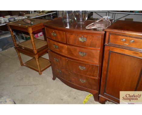 A 19th century bow front chest; with two short over three long drawers