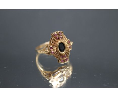 A 9CT GOLD RING, in a Deco type setting with sapphire and rubies, approx weight 3.2g, ring size P