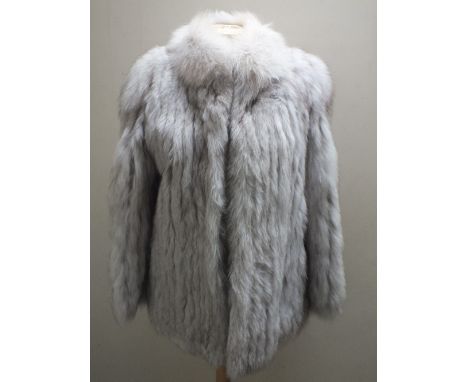A LADIES VINTAGE 'SAGA' SILVER FOX FUR JACKET, fully lined, makers label for 'Saga Fox', hook fastening and front pocketsCond