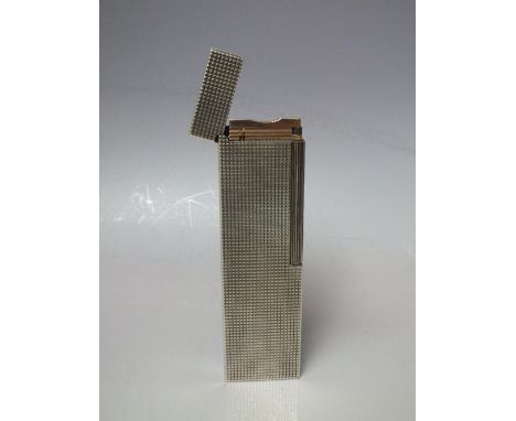 A LARGE VINTAGE S.T. DUPONT TABLE LIGHTER, silver plated with all over diamond point textured finish, H 15 cm