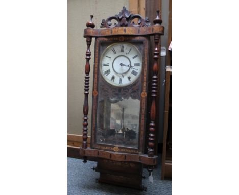 AN AMERICAN INLAID WATERFALL WALL CLOCK, the enamel dial with Roman numerals, pierced fretwork carved detail, pendulum, H 97 